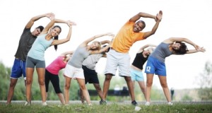 Group-of-people-doing-stretching-exercises.--500x281